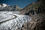 A glacier, mountains in the background