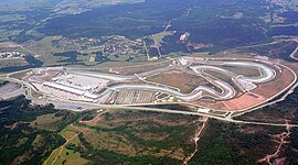 Istanbul Park is in a rural area and is paved with tarmac. It has large concrete and gravel run-off areas, large grandstands and a substantial pit building and paddock.