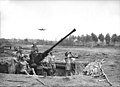 An Australian Bofors 40 mm anti-aircraft gun of the 2/9th Light Anti-Aircraft Battery at Milne Bay No. 1 Airstrip