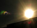 Lens flare used to capture details of too bright motive (partial solar eclipse)