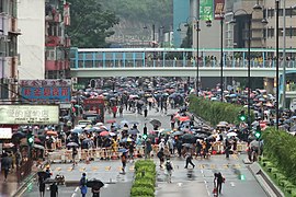 Protesters used materials from a nearby construction site to set up roadblocks on Yeung Uk Road.