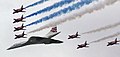 Image 21Concorde (and the Red Arrows with their trail of red, white and blue smoke) mark the Queen's Golden Jubilee. With its slender delta wings Concorde won the public vote for best British design. (from Culture of the United Kingdom)