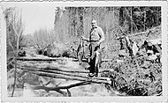 Heisey fishing in stream in Red Lake area 1936