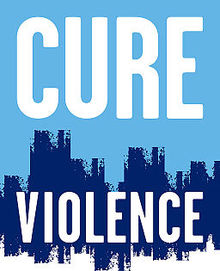 Cure violence logo, displaying their name in front of a cityscape.