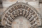 Circa 1434, Spain. Jesus Christ surrounded by twelve men with instruments and wearing crowns, above the main entrance of the Church of San Martiño de Noia.