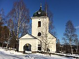 Kyrkan och stigluckan från väster