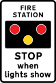 Fire station ahead, STOP when lights show. "FIRE" may be varied to "AMBULANCE"