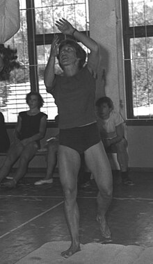 Gymnast Ágnes Keleti assisting another gymnast