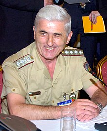 Photo of General Zlatan Stoykov in uniform sitting at a table