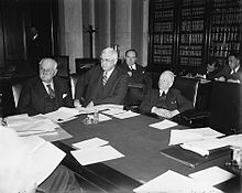 Photo of Jones seated at a meeting of the Reconstruction Finance Corporation