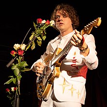 Singer-songwriter Kevin Morby performing on stage.
