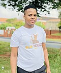 Khuzani wearing his 2021 album promoting T-shirt