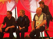 Stackridge being interviewed at the 2008 Glastonbury Festival. From the left: Andy Davis, James Warren, Mutter Slater and Crun Walter.