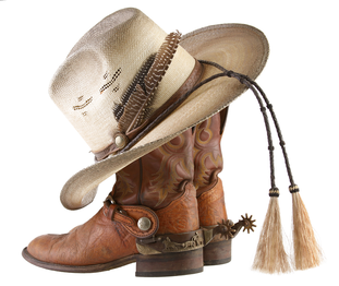 Example of cowboy hat and cowboy boots, two prominent components of country music fashion