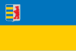 The flag of Zakarpattia Oblast, defaced with a Coat of arms