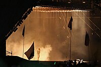 Kanye West performing at the 2015 Glastonbury Festival.