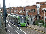 Stadler Variobahn tram 2556 calls at Reeves Corner