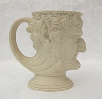 Mug moulded as satyr's head, caneware (?)