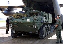 The M1129 being unloaded from a C-130 Hercules aircraft