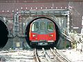 A Northern Line train leaving the tunnel just north of Hendon Central station.