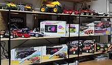 A photo of a collection of radio controlled toys from Taiyo RC and Tyco RC.