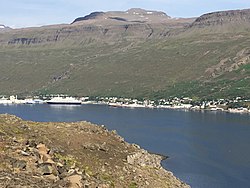 Eskifjörður with cruise ship Prinsendam at its wharf, 2017