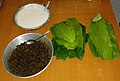 Parbolied (ukadeñ tândul) rice paste, jaggery-coconut mixture (chûn), and turmeric leaves (hôldi pân)