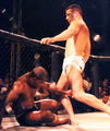 Image 54A "soccer kick", movement where the fighter kicks the head of a downed opponent. While common in vale tudo, early MMA and Japanese promotions, the soccer kick has been banned from the Unified Rules of Mixed Martial Arts. (from Mixed martial arts)