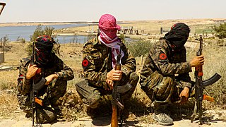 IRPGF fighters resting during the Battle of Tabqa