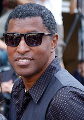 Babyface smiling to the camera wearing sunglasses.
