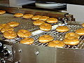 Glazed doughtnuts being made at a Krispy Kreme factory