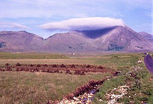 Letterbreckaun (right, in cloud) with the v-shaped pass of Maam Turk (left)