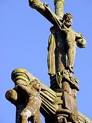 Another view of the cross. We can see two small angels at Jesus' feet. They collect his blood in chalices.