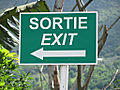 An exit sign in Mauritius in French and English