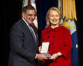 Secretary Panetta presents former Secretary of State Hillary Rodham Clinton with the medal.