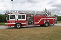 Palm Beach County Fire-Rescue Quint 57, stationed in suburban Boca Raton, Florida. This unit was manufactured by Ferrara Fire Apparatus.