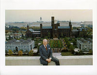 Eighth Secretary of the Smithsonian S. Dillon Ripley with the completed quadrangle and Haupt Garden in the background