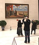 Tourists photographing the painting