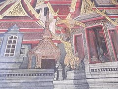 A mural depicting King Mongkut looking through a telescope