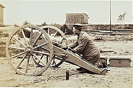 A 6 cm L/21 in firing position with ammunition boxes dismounted.