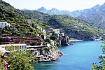 Mountainous coastline with terraces and buildings