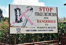 Campaign sign against female genital mutilation that reads:Stop Female Circumcision It is Dangerous to Women's Health