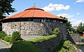 The waterfront park passes Tresse (Retranchementet) and Christiansholm Fortress.