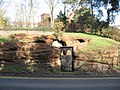 The sign next to the entrance says "Wolverley Pound, formerly used for impounding animals found straying until ransomed by their owners".[19]