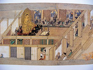 Monks gather for a debate in a Buddhist temple room walled with shoji