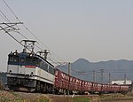 A Japan Rail Freight EF65 class electric locomotive pulls a short freight train on the Yosan Line in 2012