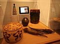 Anthropological artefacts: wicker basket, 20th century Basotho fertility doll, vase, drum