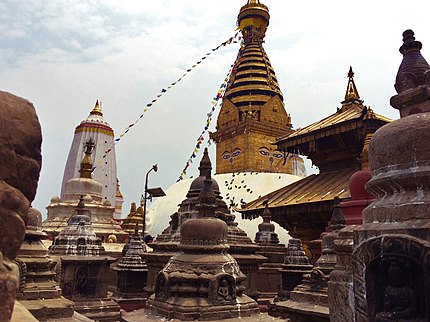 Swayambhunath stupa along with smaller stupas and pagodas in the foreground