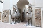 Winged bulls (Neo-Assyrian); c.710 BC; alabaster; height (max): 4.2 m; Louvre[17]