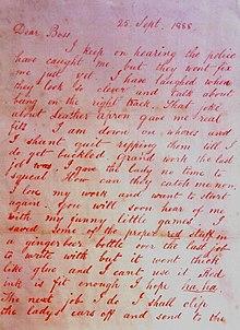 Lettre écrite à l'encre rouge sur papier.